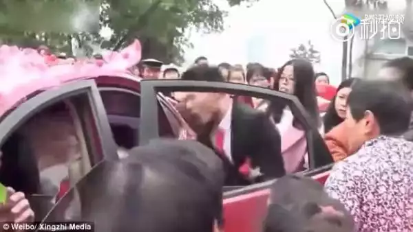 Angry Groom Violently Drags His Bride Out Of TheirWedding Car After Receiving Video of Her Cheating
